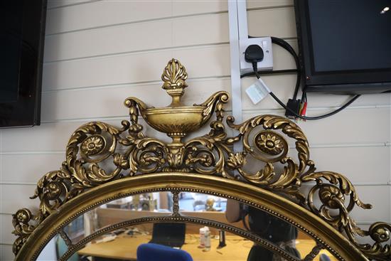 A mid 20th century carved giltwood wall mirror, W.3ft 9in. H.4ft 8in.